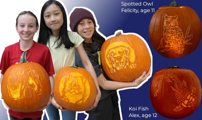 Three kids proudly holding carved animal pumpkins